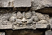 Prambanan - Candi Lara Jonggrang, makara figure as dwarapala at foot of the door 